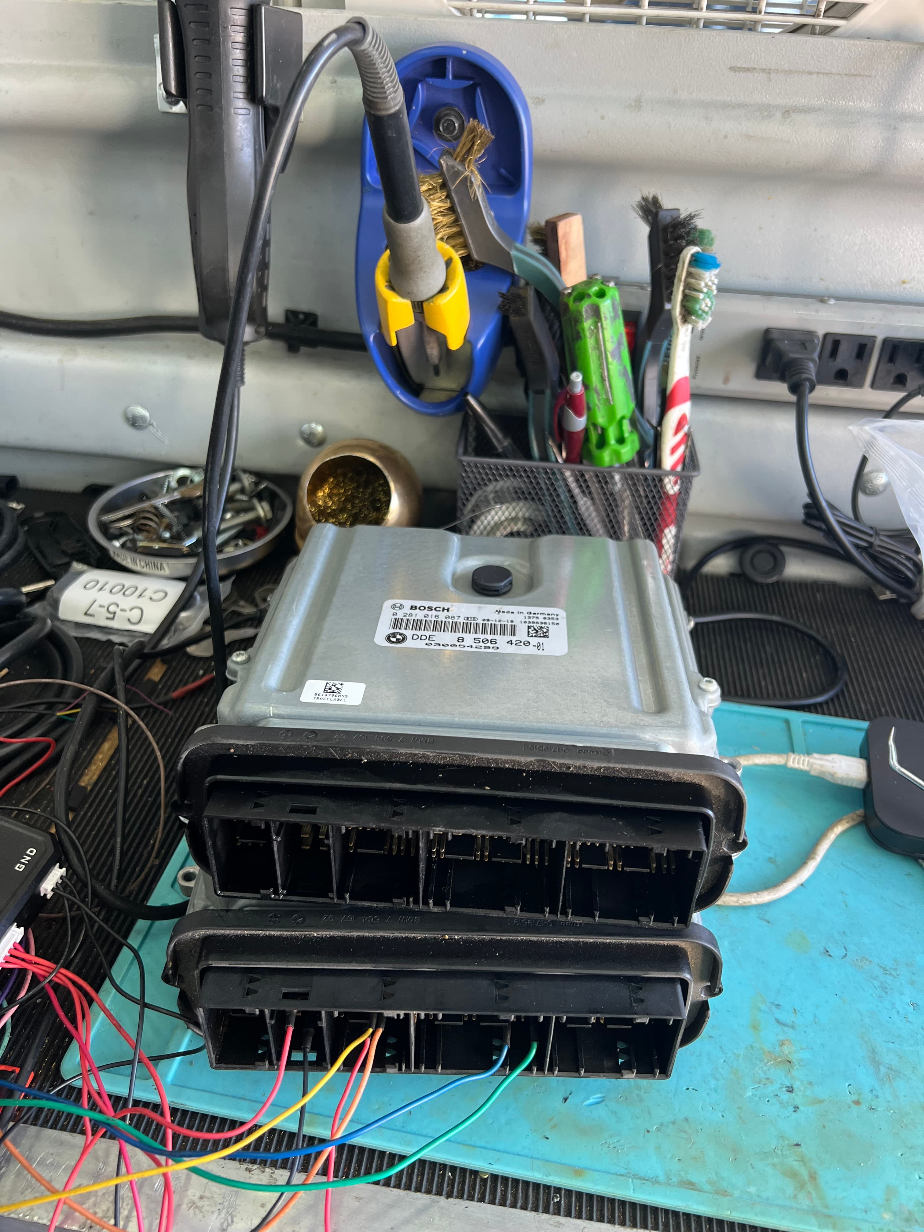 ECM and PCM automotive control modules on programming workbench β Prestige Mobile Locksmith Austin TX